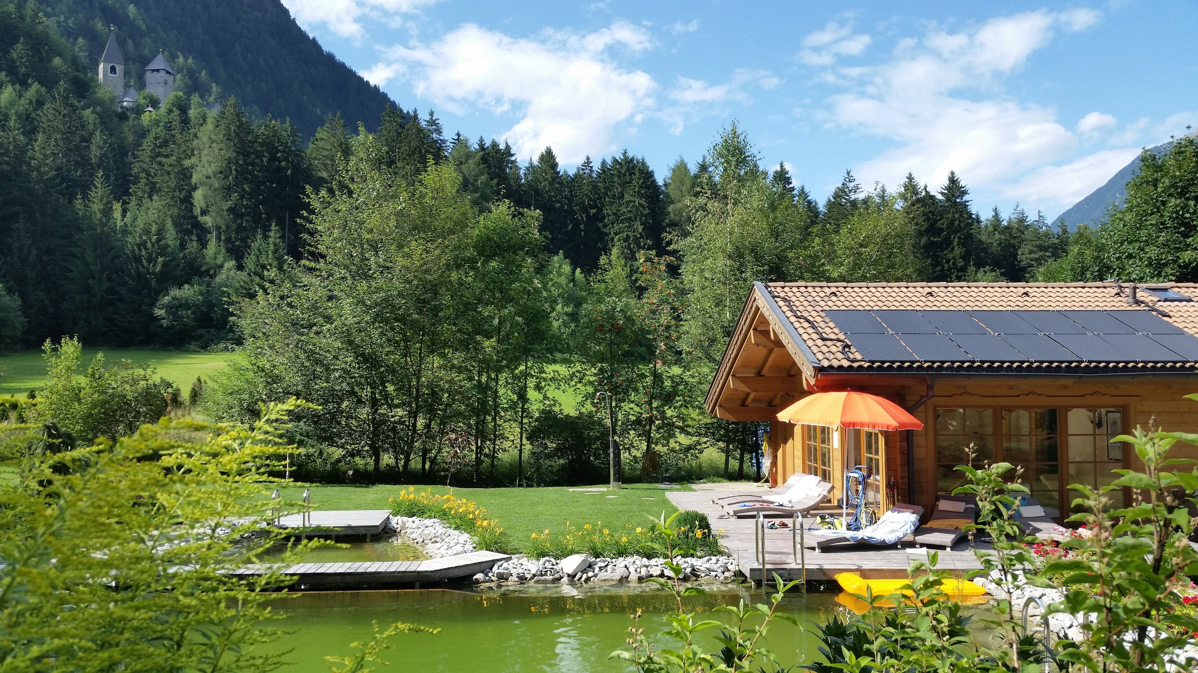 outdoor pool, a natural pool, pool loungers