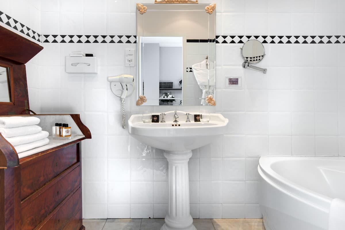 superior room (château) | bathroom | hair dryer, towels, soap, shampoo