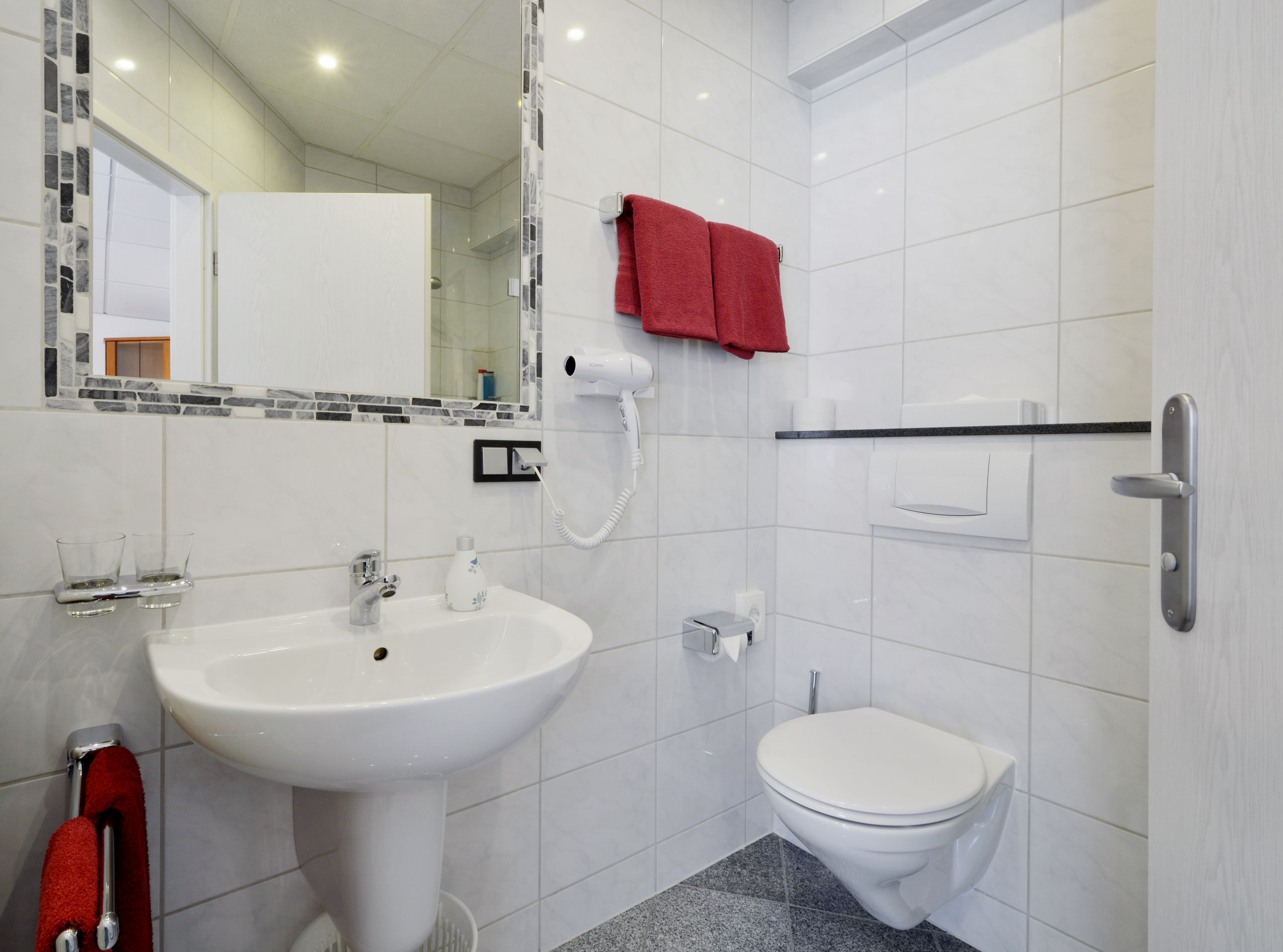 junior suite | bathroom | shower, hair dryer, towels