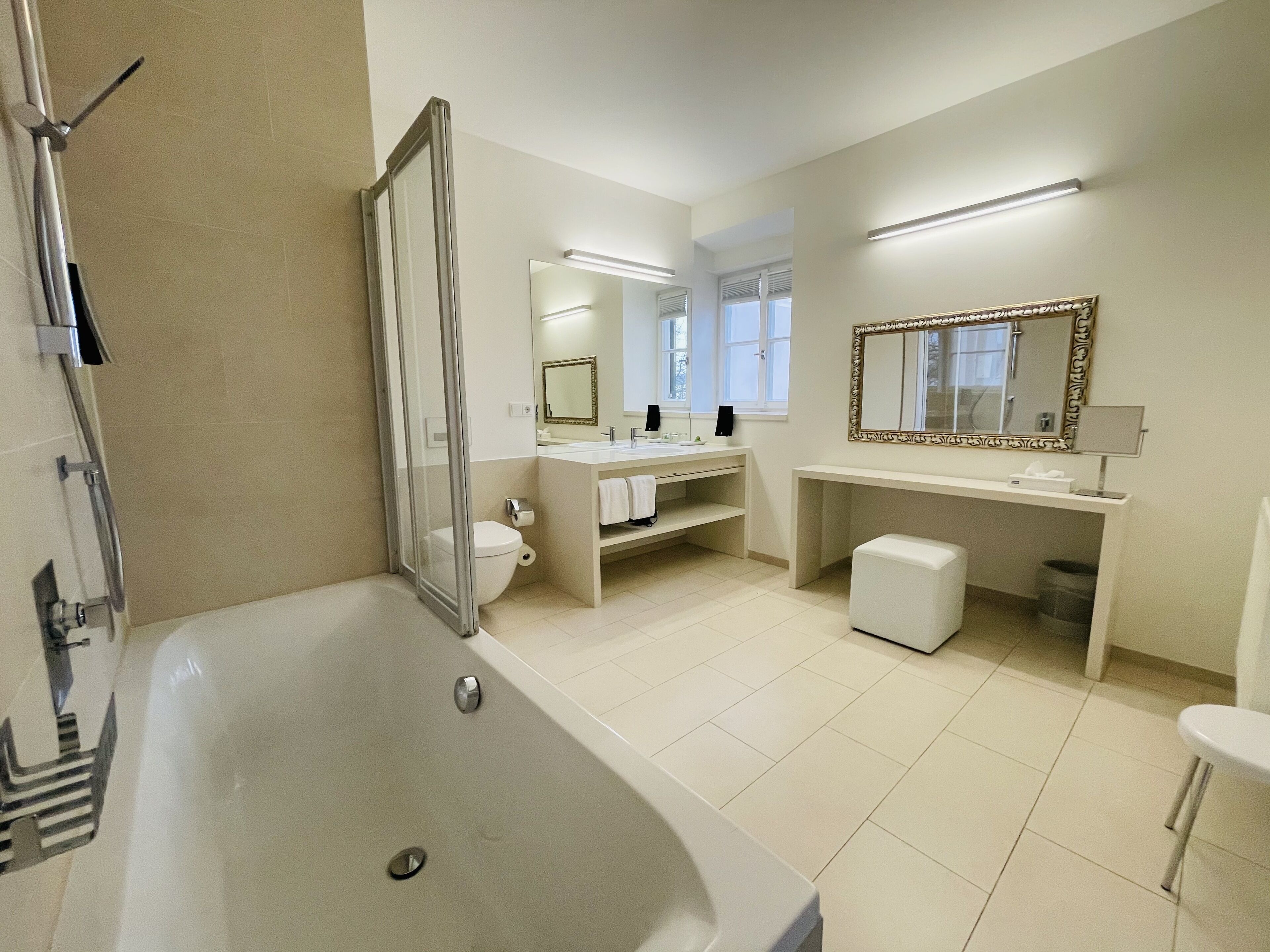 deluxe room | bathroom | shower, free toiletries, hair dryer, bathrobes