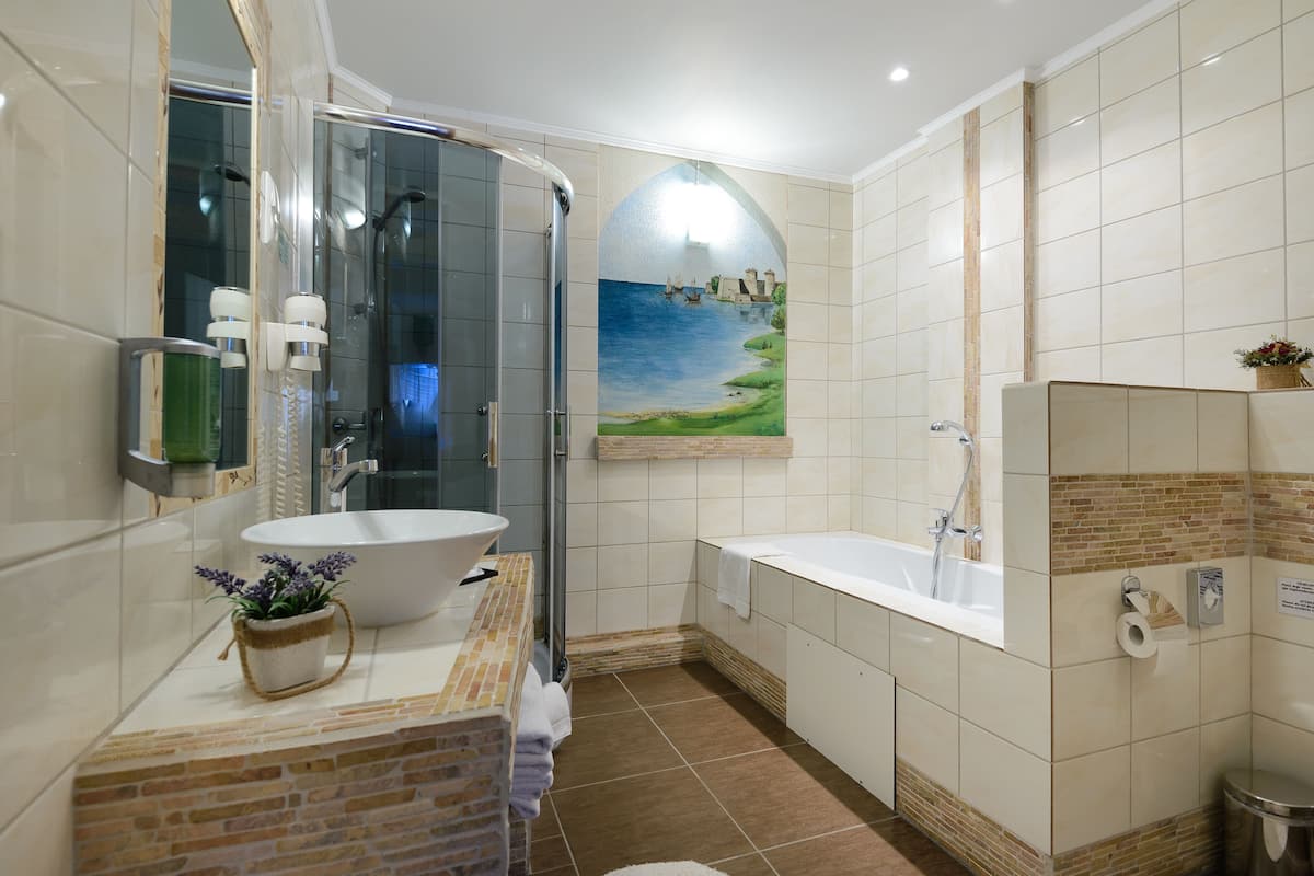 deluxe family room | bathroom | free toiletries, hair dryer, towels