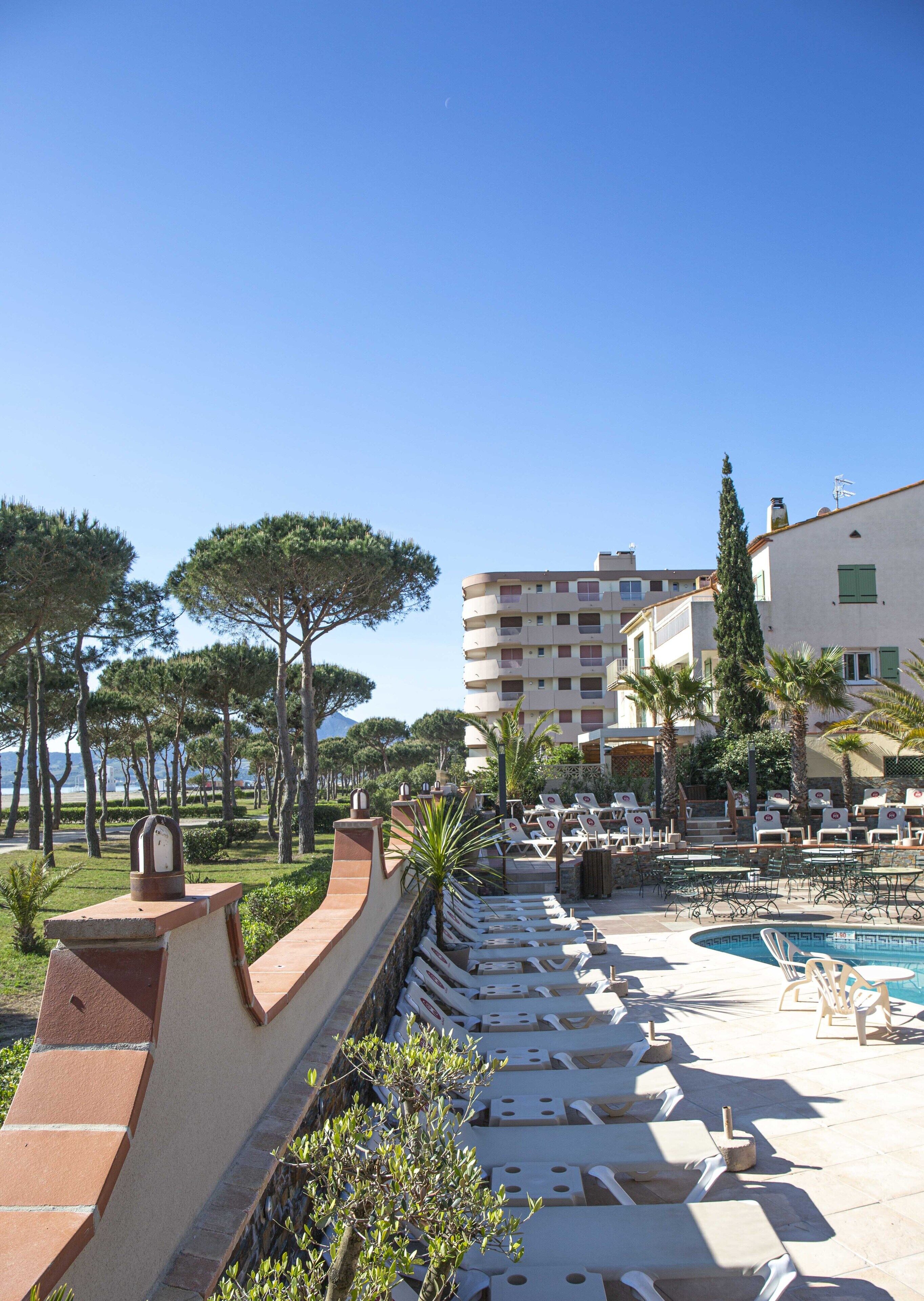 outdoor pool, pool umbrellas, pool loungers