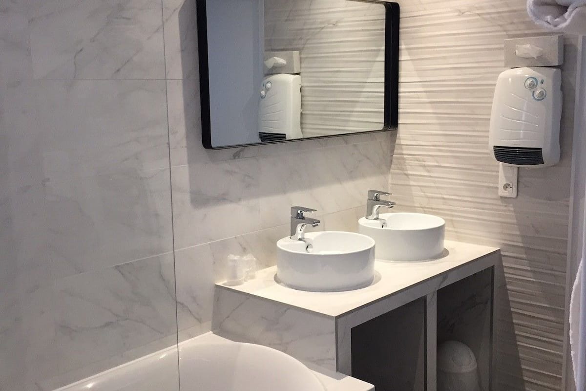 tradition twin room | bathroom | hair dryer, towels