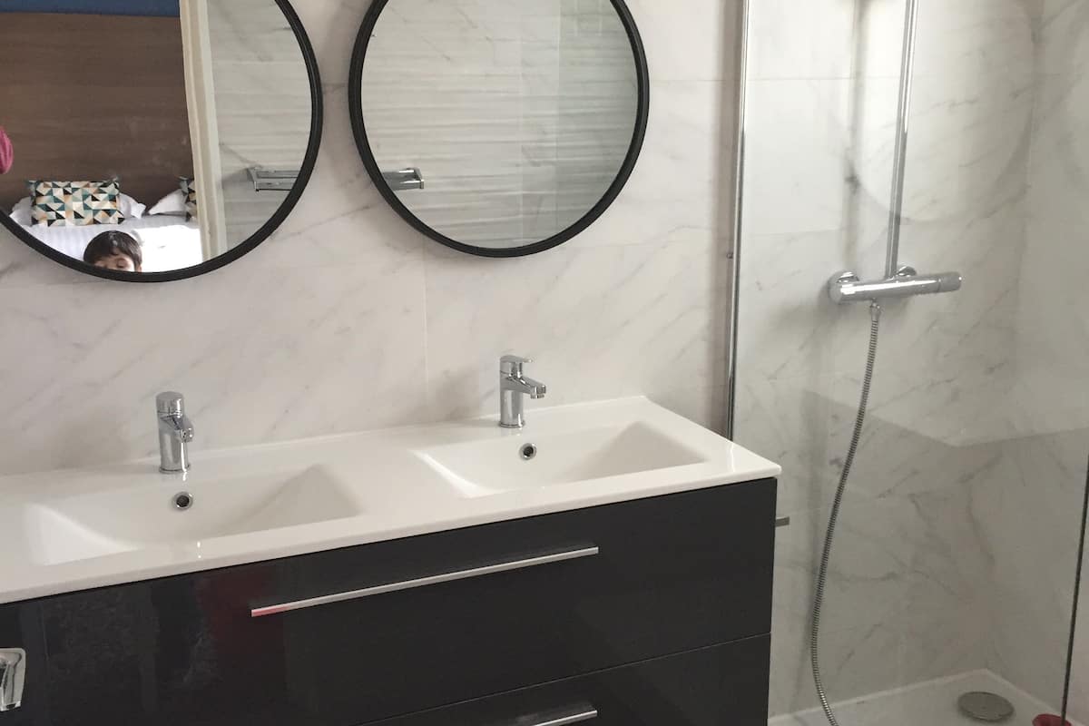 superior family room | bathroom | hair dryer, towels