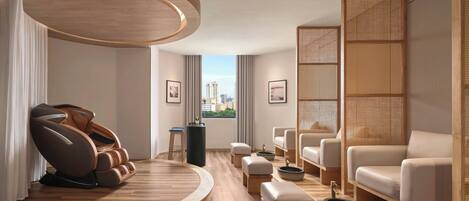 A modern spa room with a massage chair, seating area, and a view of the city.