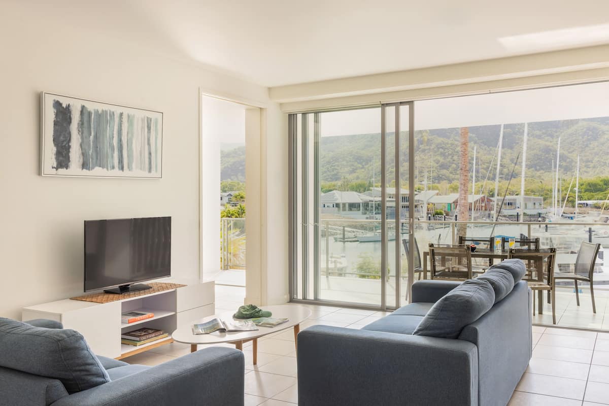 Room, 3 Bedrooms | Living area | Flat-screen TV, DVD player