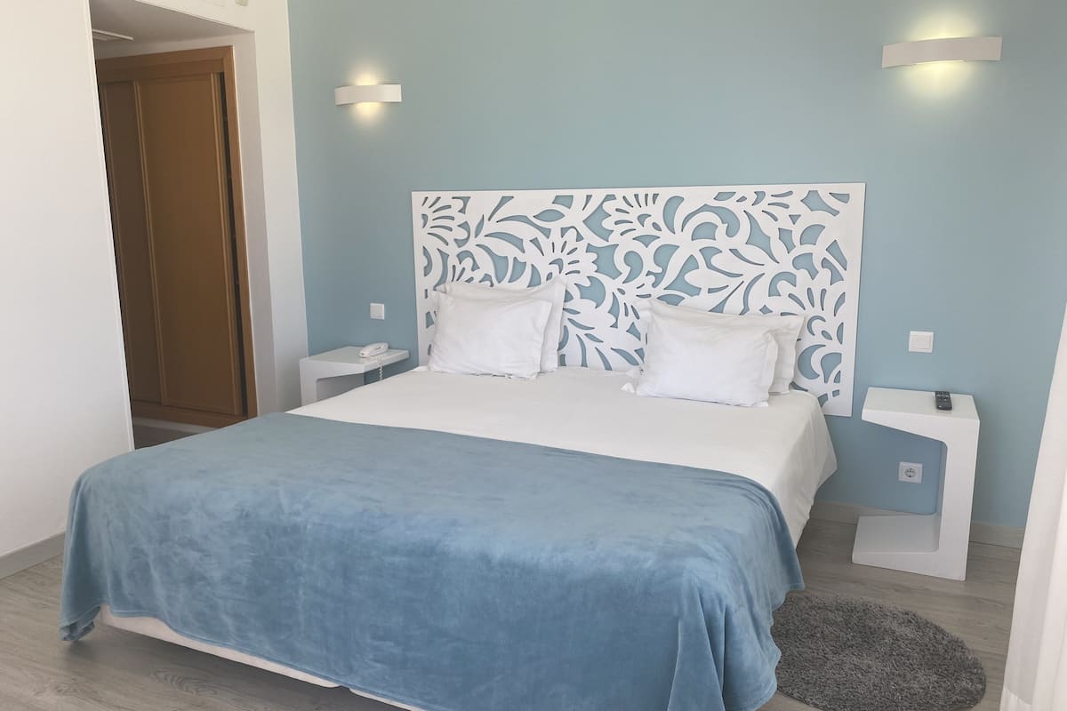 minibar, blackout curtains, iron/ironing board, free wifi