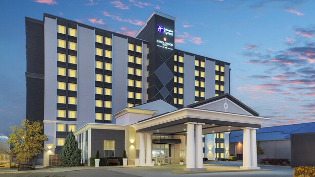 A modern hotel with a prominent sign for Holiday Inn Express Candlewood Suites. - Holiday Inn Express & Suites Chatham South by IHG (Chatham-Kent)