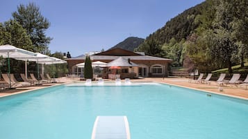 Seasonal outdoor pool, pool loungers