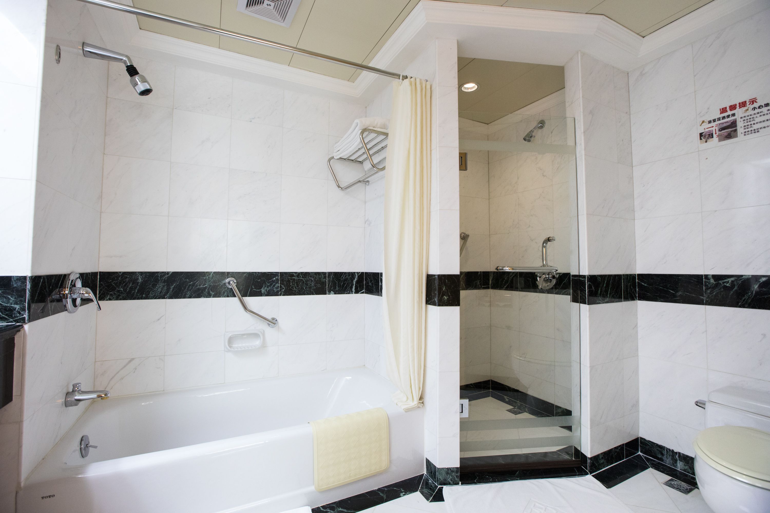 shower, hair dryer, slippers, towels