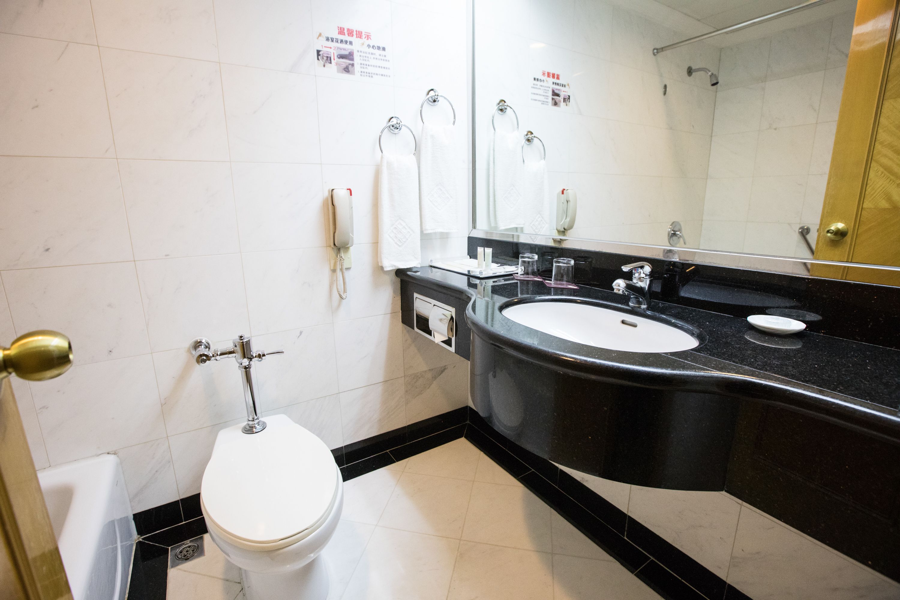 standard twin room | bathroom | shower, hair dryer, slippers, towels