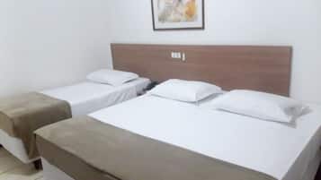 Deluxe Room, Multiple Beds | Minibar, desk, free WiFi, bed sheets