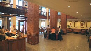 A spacious lobby with high ceilings, ornate columns, and a central seating area. - Panorama Hotel (Yangon)