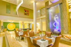 Breakfast, lunch, dinner served; pool views - Neelams The Glitz (Calangute)