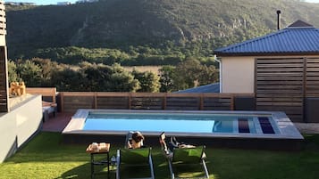 2 outdoor pools, pool umbrellas, pool loungers