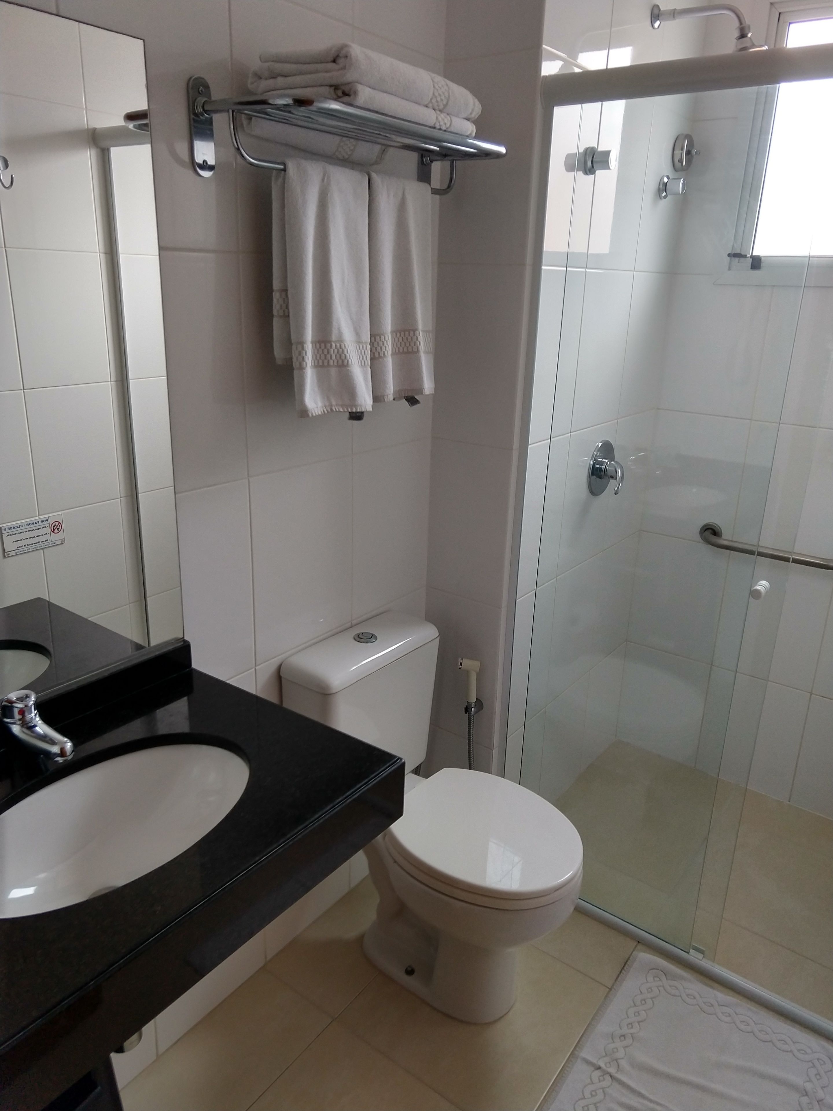 shower, rainfall showerhead, hair dryer, towels