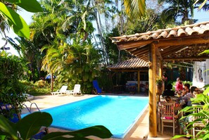 Outdoor pool, open 10:00 AM to 10:00 PM, pool umbrellas, pool loungers