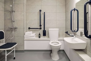 Eco-friendly toiletries, hair dryer, towels, toilet paper