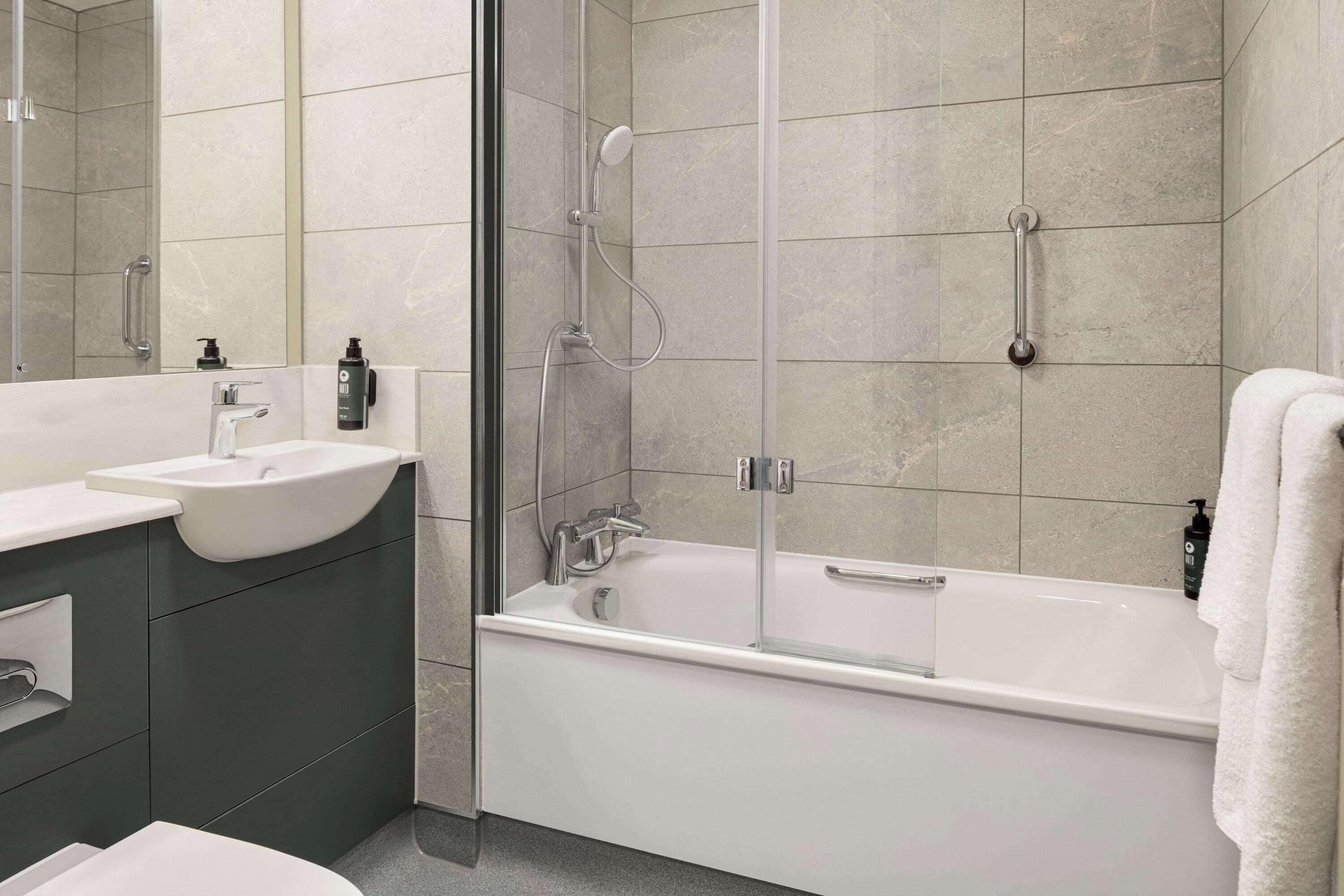 Eco-friendly toiletries, hair dryer, towels, toilet paper