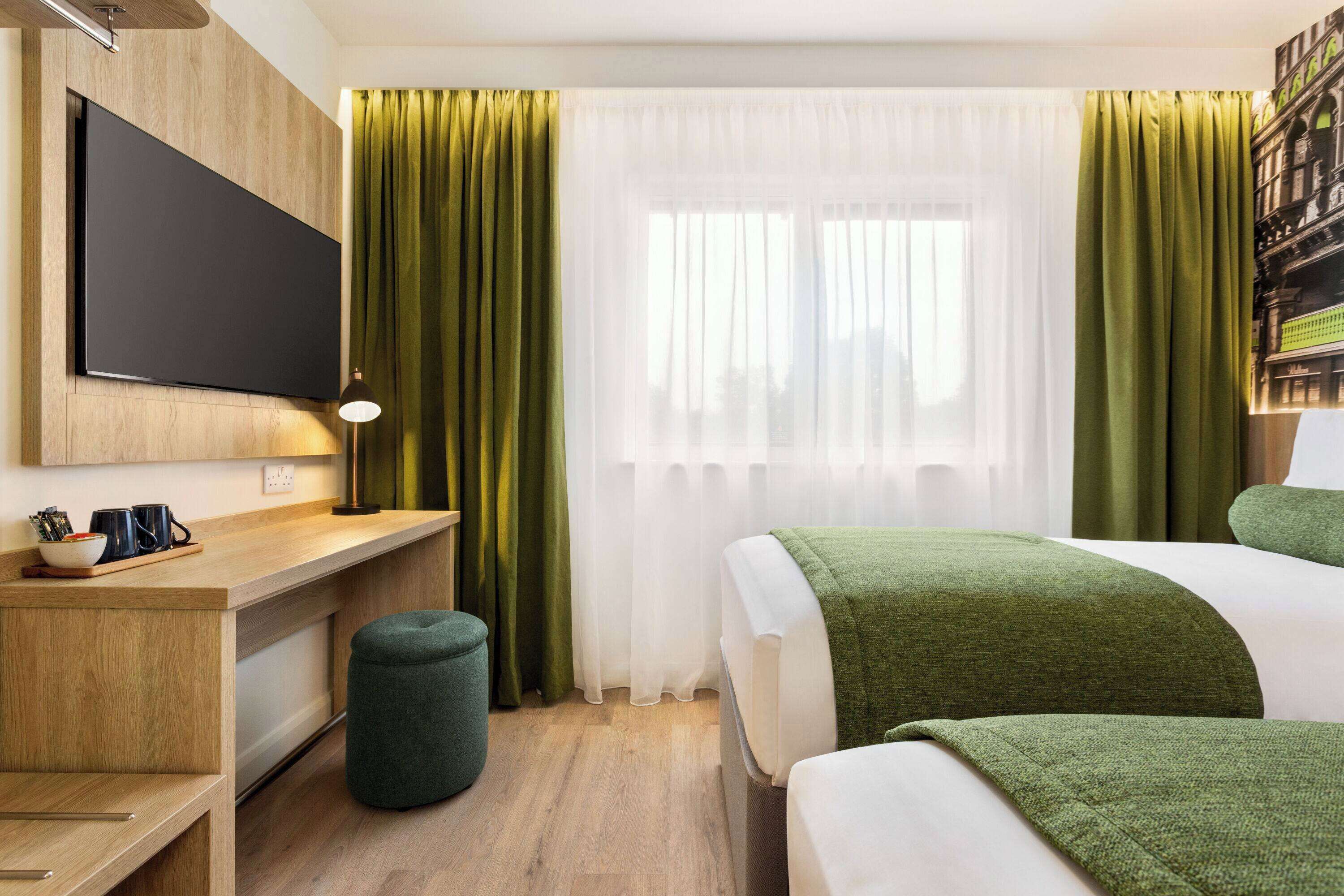 family room (1 king bed and 2 twin beds) | desk, laptop workspace, free cots/infant beds, free wifi