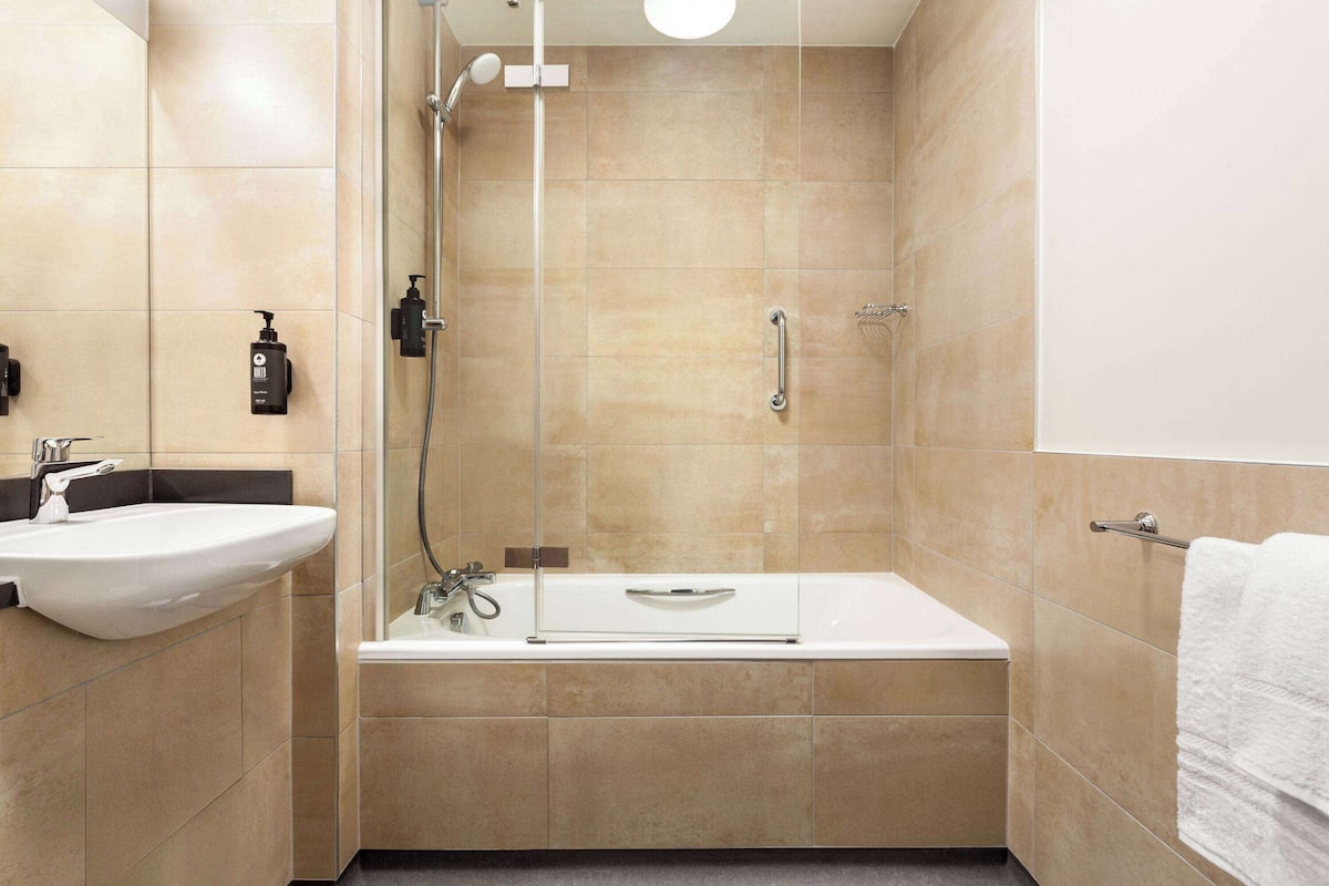 family room (1 king bed and 2 twin beds) | bathroom | combined shower/bathtub, eco-friendly toiletries, hair dryer, towels