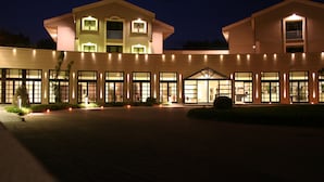 A large, modern building with multiple windows and a central entrance. - Grand Hotel Villa Itria (Viagrande)
