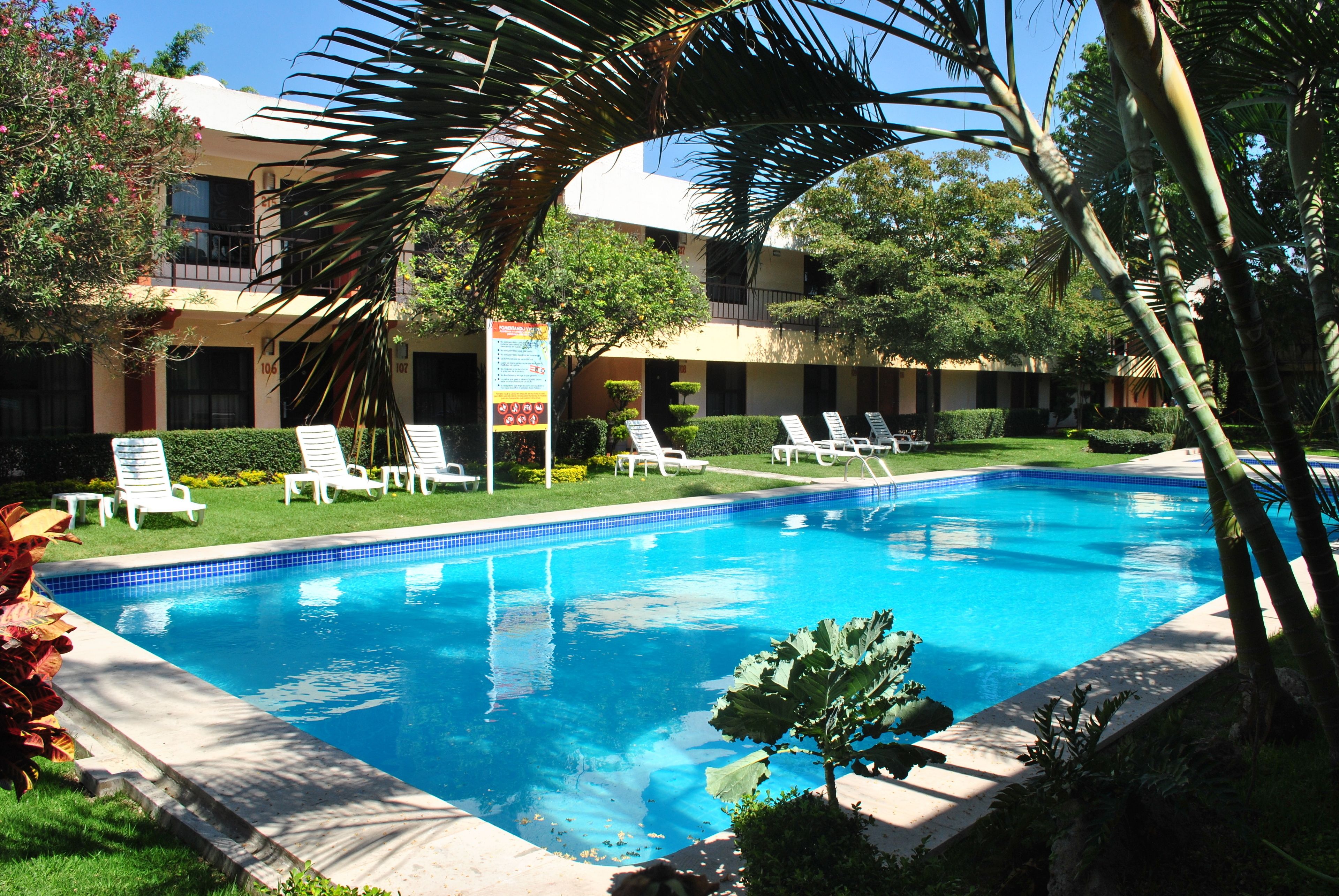 standard room, 2 double beds | living area | 32-inch lcd tv with cable channels, tv, dvd player