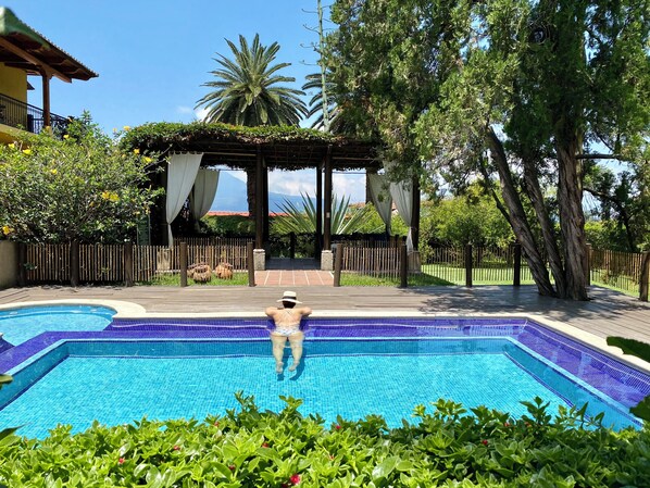 2 outdoor pools, pool umbrellas, pool loungers