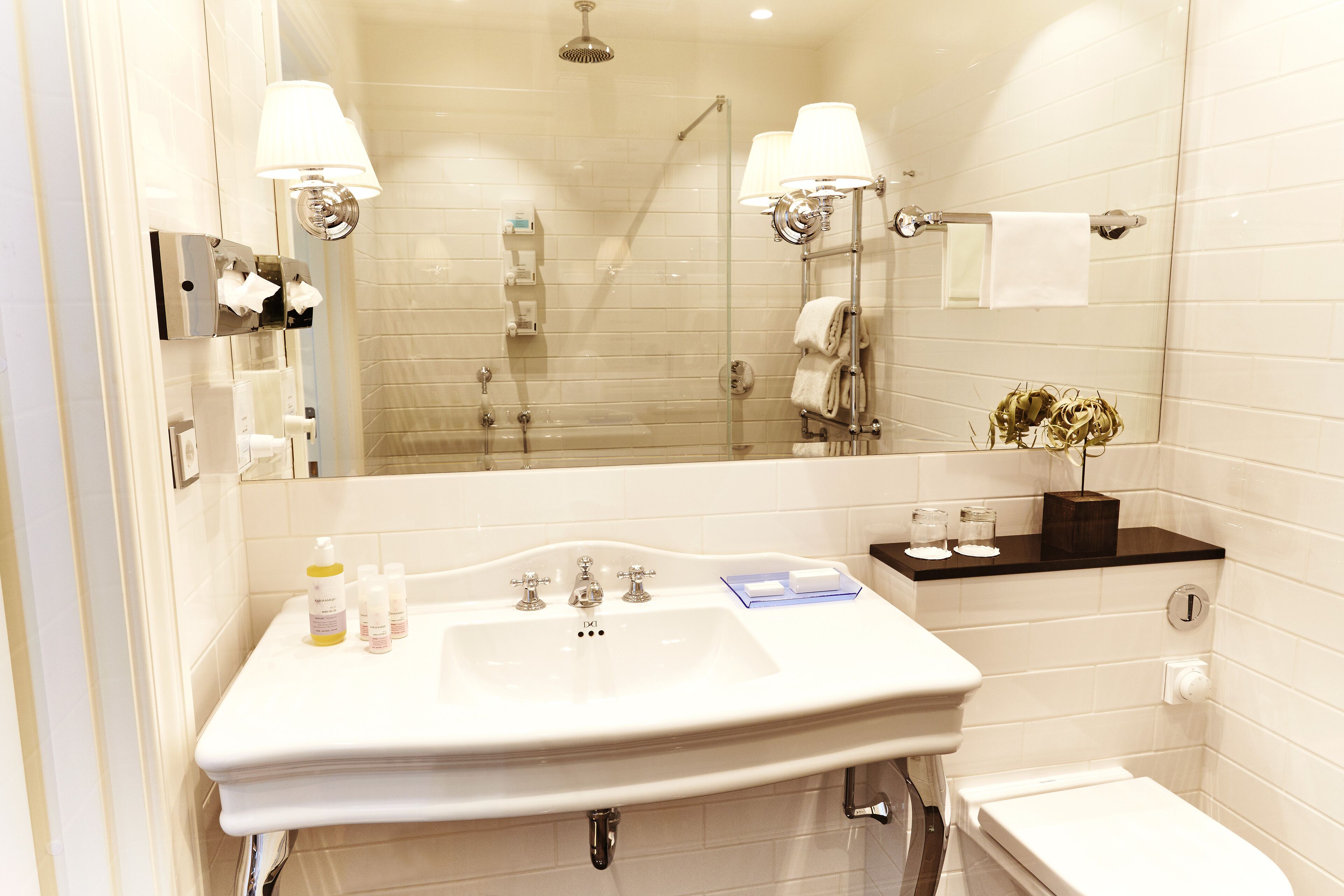 designer toiletries, hair dryer, bathrobes, slippers