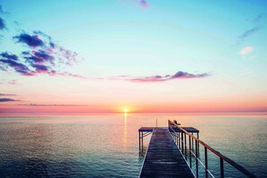 A wooden pier extending into calm waters at sunset. - Kurhotel Skodsborg (Skodsborg)