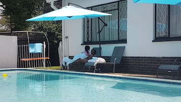 Outdoor pool, pool umbrellas, pool loungers