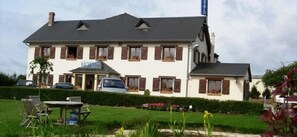 A two-story building with a sign reading "Hotel".