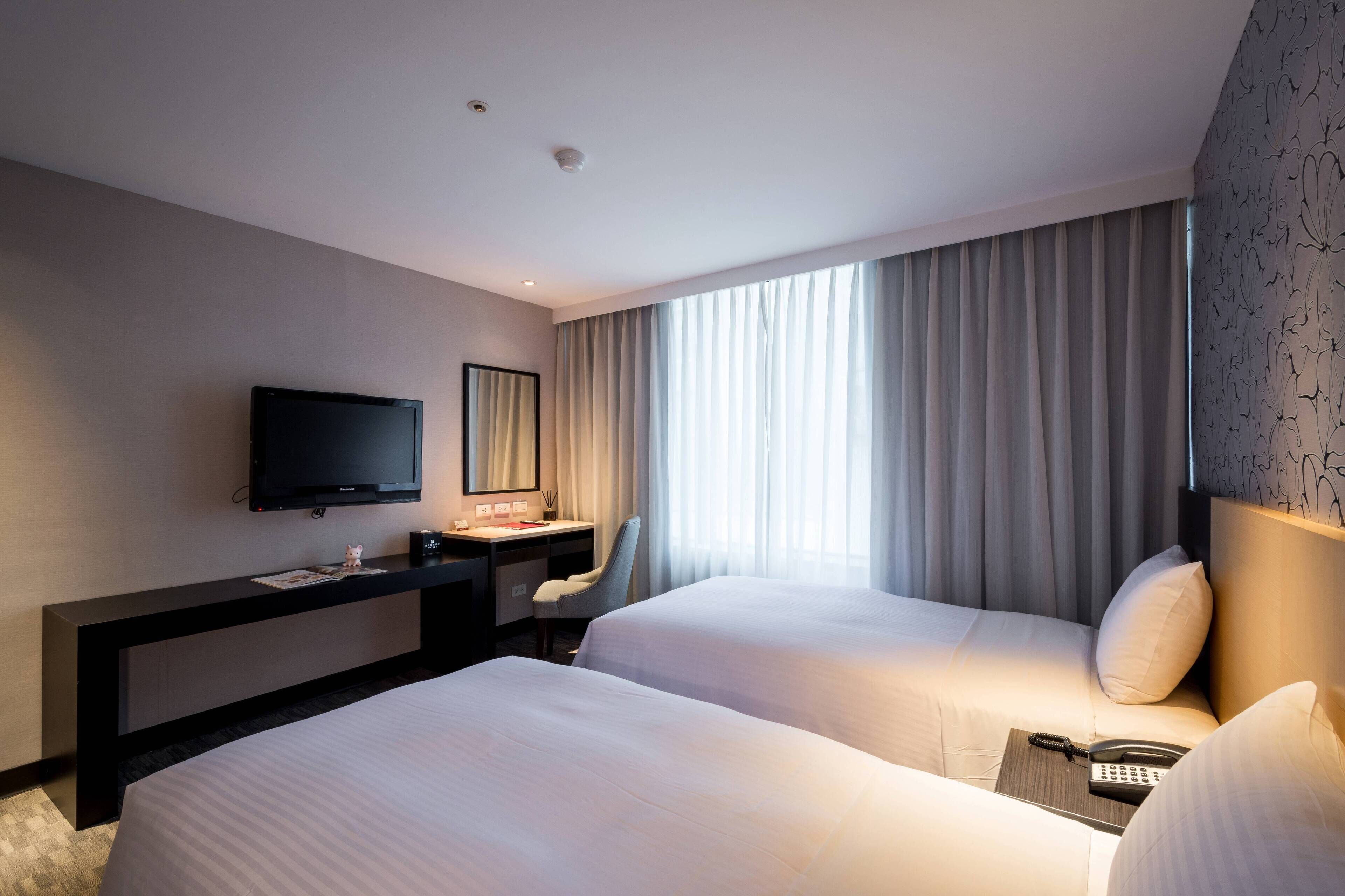 business twin room, 2 single beds | in-room safe, desk, blackout curtains, bed sheets