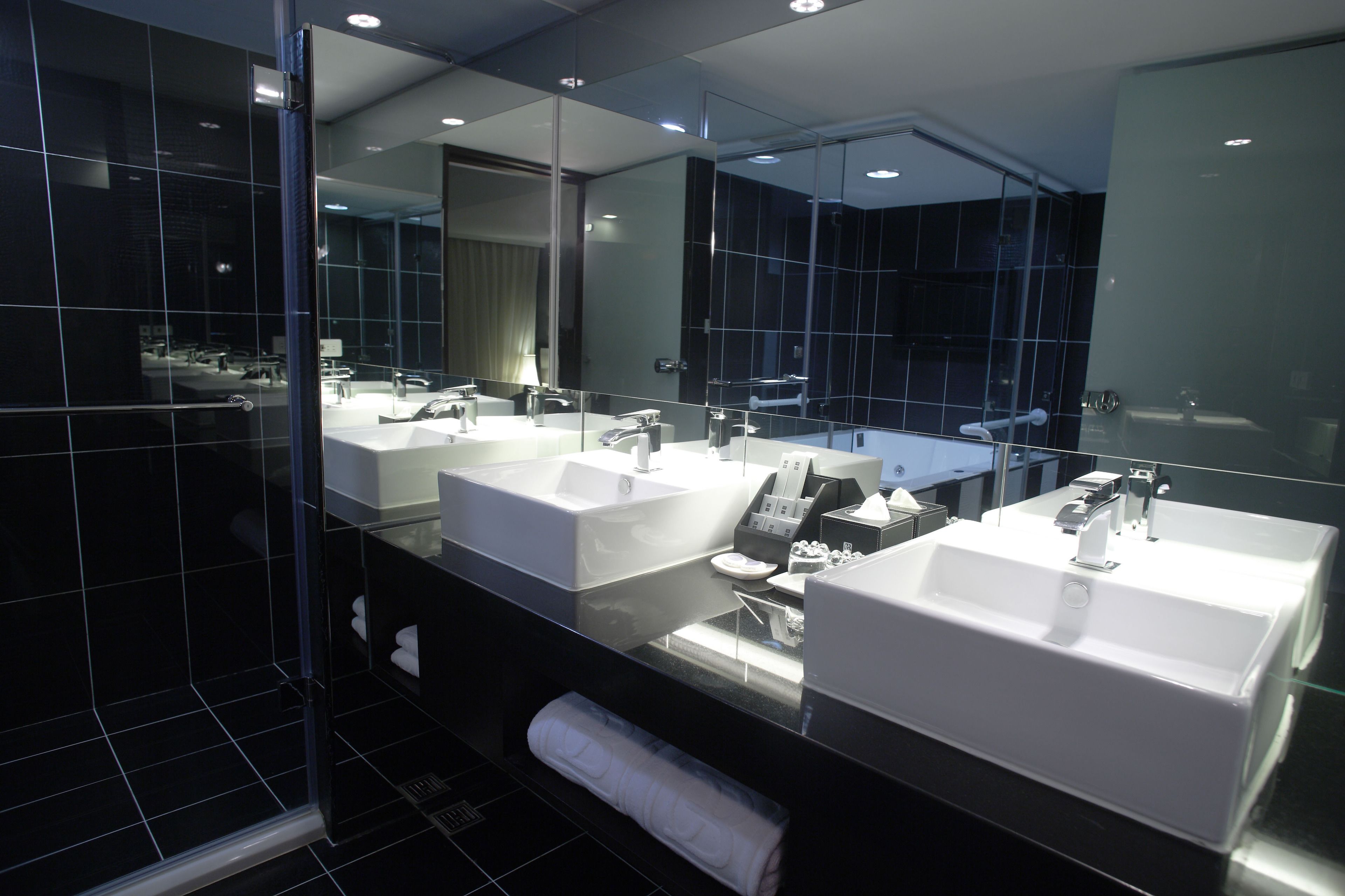 executive suite, 1 king bed | bathroom | free toiletries, hair dryer, slippers, towels