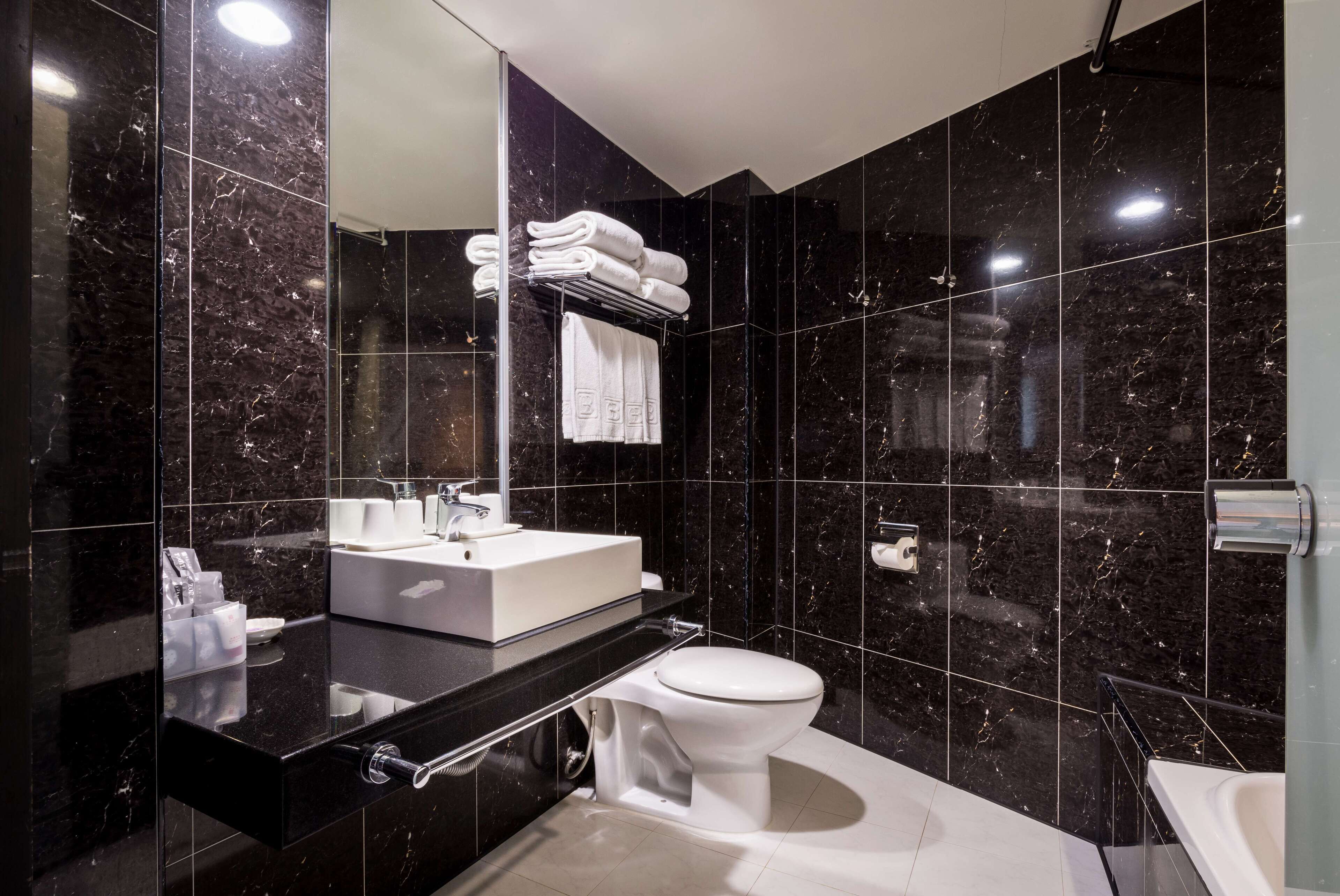 quadruple room, 2 double beds | bathroom | free toiletries, hair dryer, slippers, towels