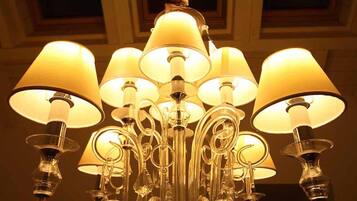A chandelier with multiple lampshades.