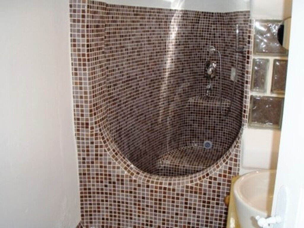 economy double room | bathroom | shower, free toiletries, hair dryer, towels