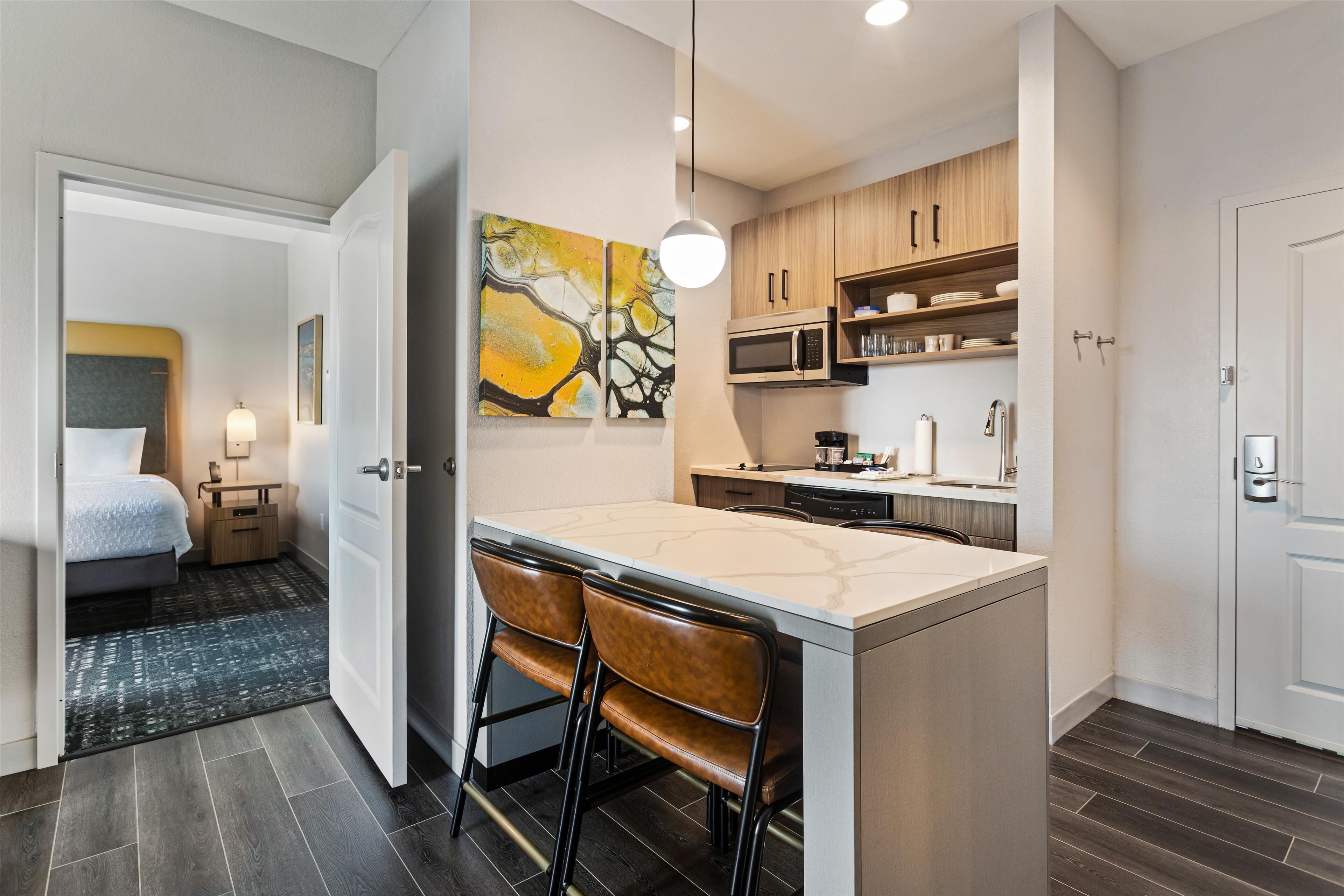 fridge, microwave, coffee/tea maker, cookware/dishes/utensils