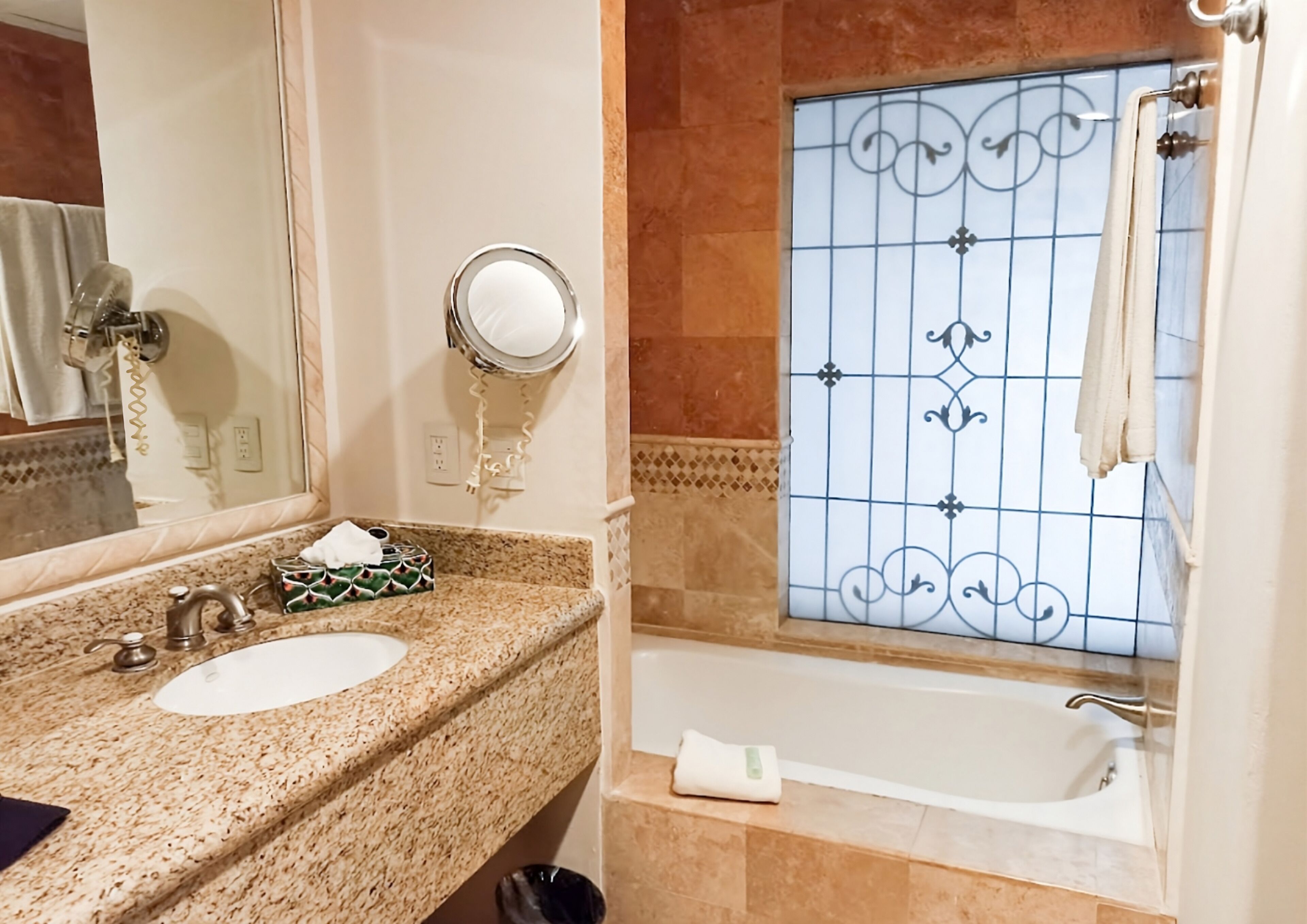 combined shower/bathtub, rainfall showerhead, designer toiletries