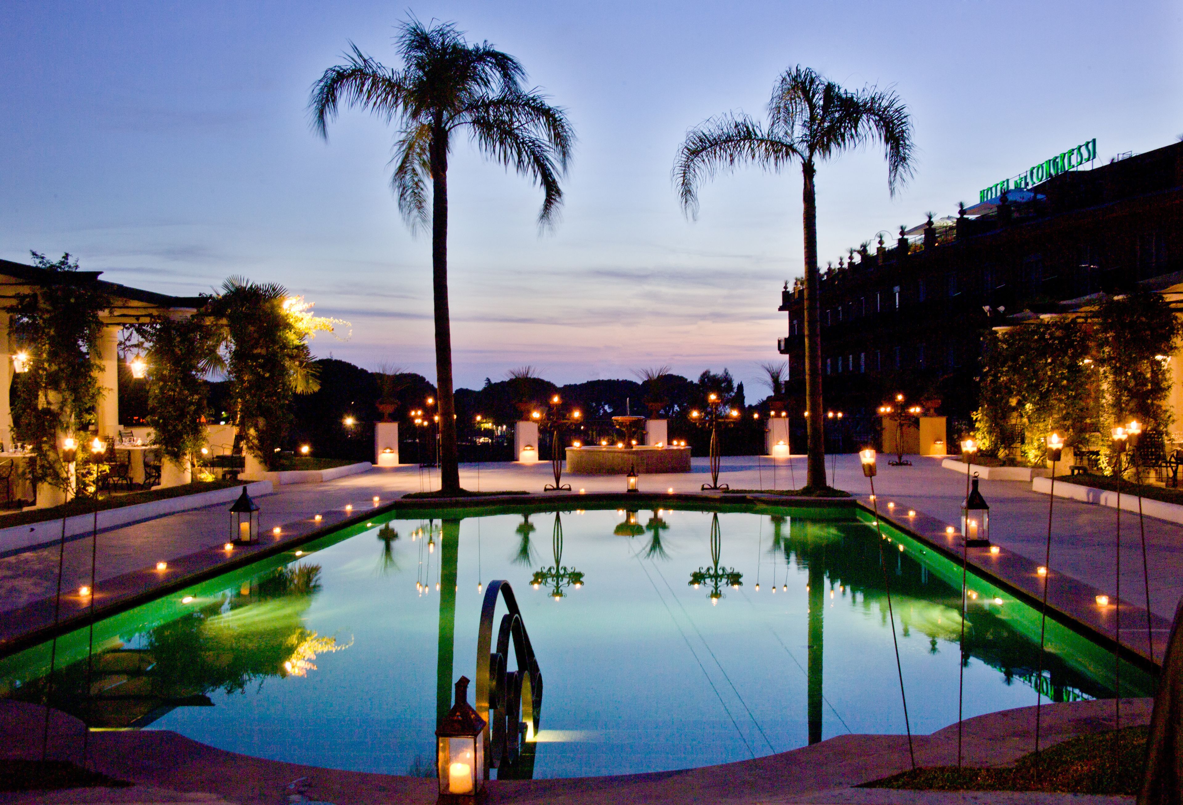 Seasonal outdoor pool, open 9:30 AM to 6:00 PM, pool umbrellas