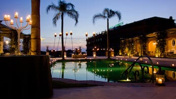 Seasonal outdoor pool, open 9:30 AM to 6:00 PM, pool umbrellas