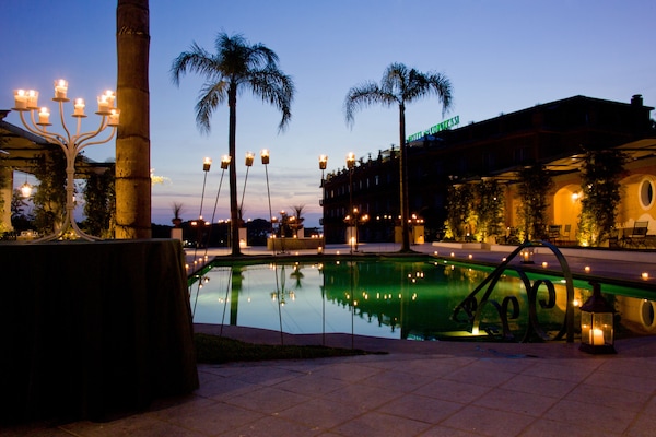 Seasonal outdoor pool, open 9:30 AM to 6:00 PM, pool umbrellas
