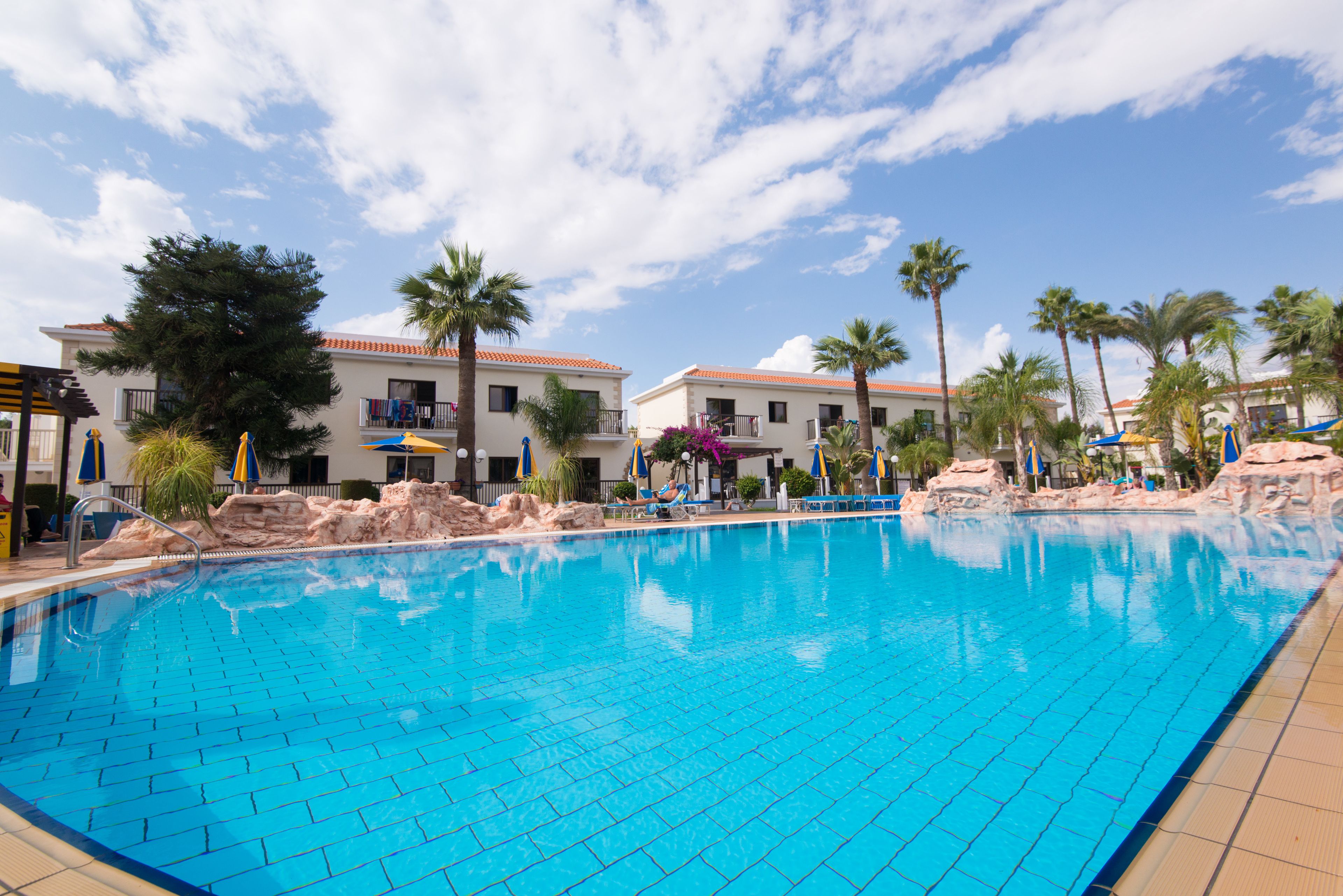 seasonal outdoor pool, pool umbrellas, pool loungers