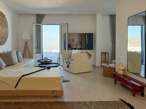 Suite ejecutiva, vista al mar | Área de sala de estar