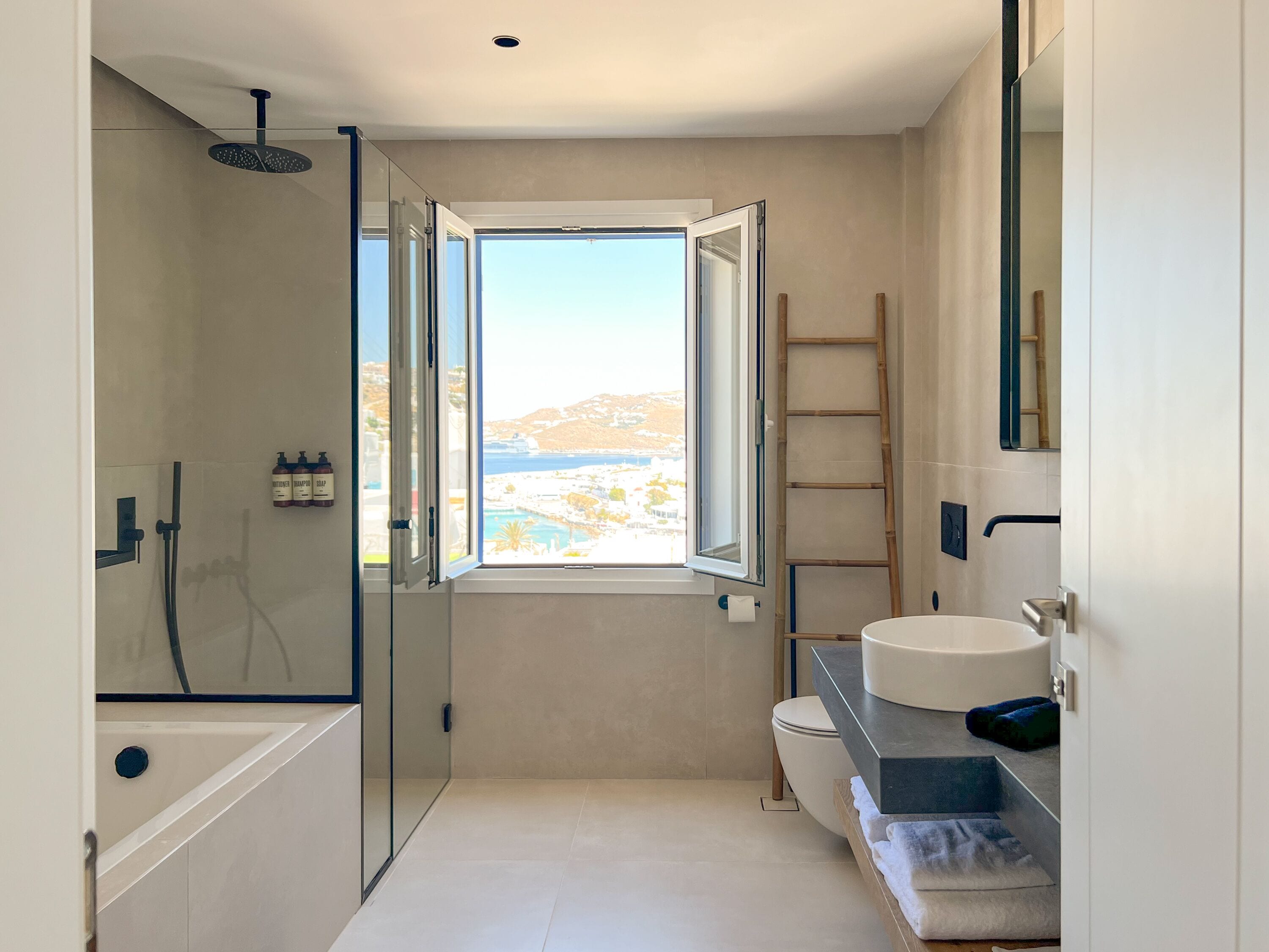executive suite, sea view | bathroom | hair dryer, bathrobes, towels