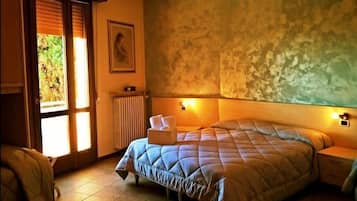 Quadruple Room, Multiple Beds | Minibar, in-room safe, desk, free WiFi