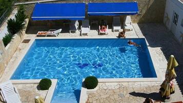 Outdoor pool, pool umbrellas, pool loungers