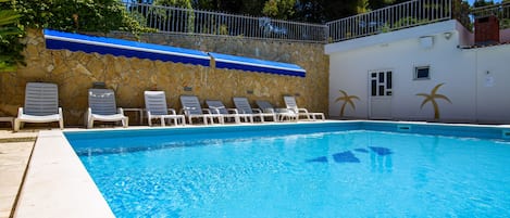 Outdoor pool, pool umbrellas, pool loungers