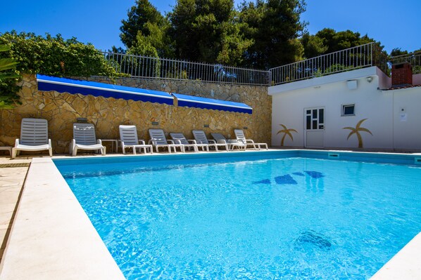 Outdoor pool, pool umbrellas, pool loungers