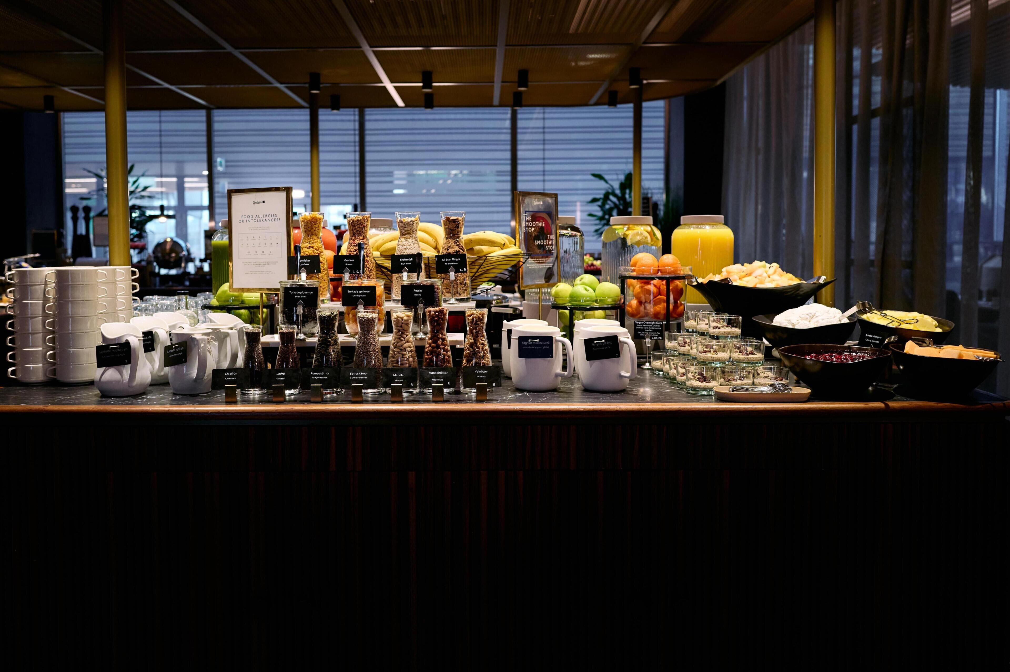 A breakfast buffet with various food items and beverages.